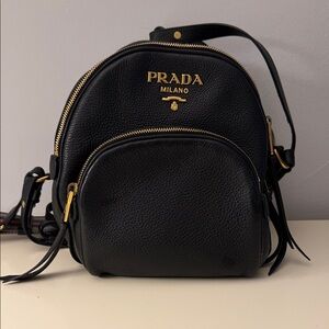 Prada Black Leather Backpack with Gold Accents